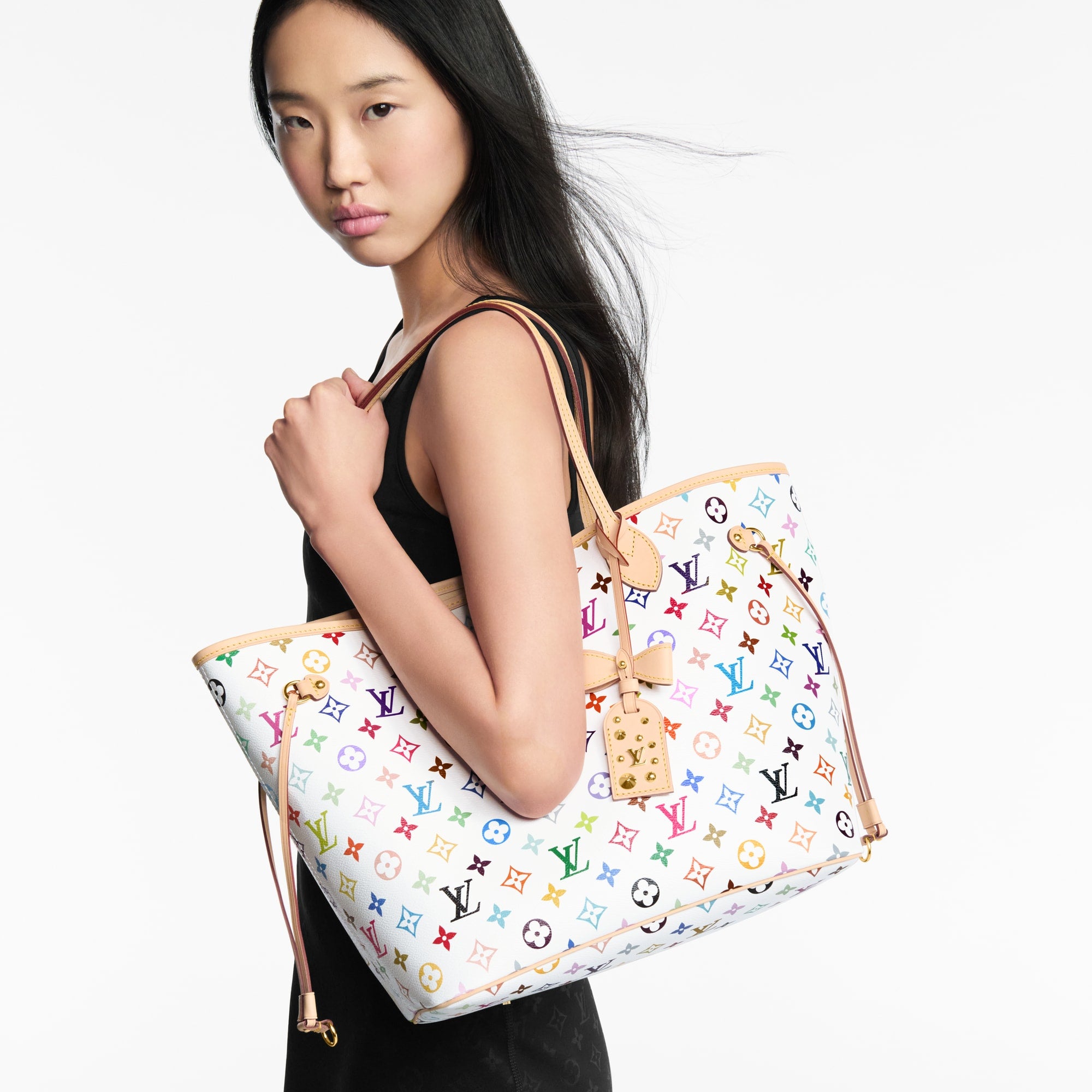 Louis Vuitton x TM Neverfull MM in Multicolor White - cropped carry view | MOAH