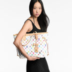Louis Vuitton x TM Neverfull MM in Multicolor White - carry view | MOAH