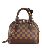 MOAH Louis Vuitton Alma Nano handbag in Damier Ebene canvas with brown leather trim, gold-tone hardware, and chain strap.