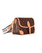 MOAH Louis Vuitton monogram canvas shoulder bag with cowhide leather trim, buckle closure, and graphic logo strap.