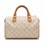 MOAH monogram canvas barrel handbag with tan leather trim and gold hardware in a retail store setting