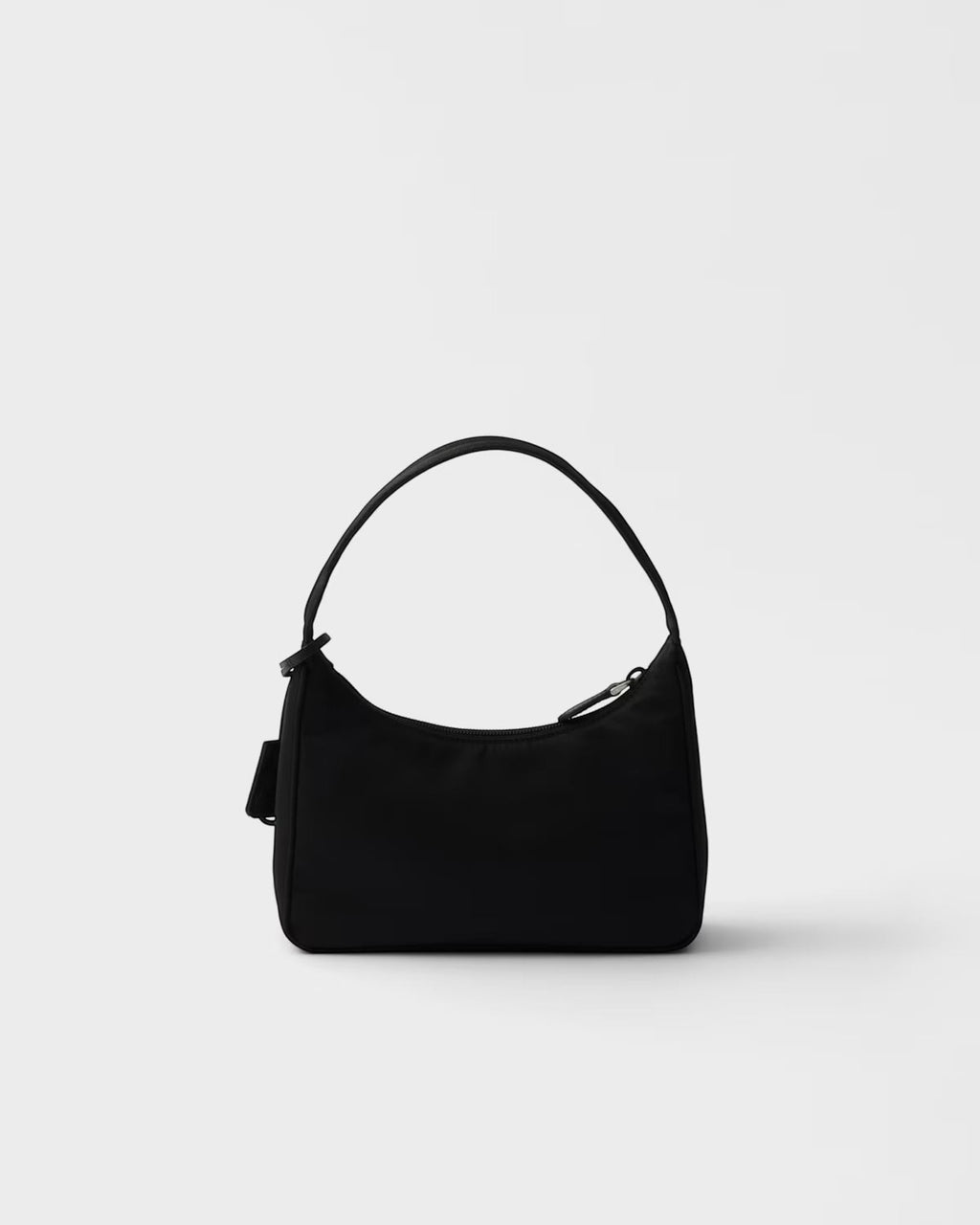 MOAH Prada Re-Edition 2000 mini bag in black recycled Re-Nylon with a woven handle and enameled metal triangle logo.