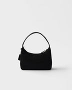 MOAH Prada Re-Edition 2000 mini bag in black recycled Re-Nylon with a woven handle and enameled metal triangle logo.