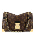 Louis Vuitton Trunkie monogram canvas shoulder bag front view with gold chain strap and metallic hardware.