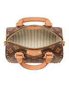 Louis Vuitton Speedy Trunk 20 top view in monogram coated canvas with cowhide leather trim and gold-tone stud details.