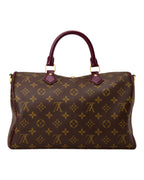 MOAH shoes Louis Vuitton Speedy handbag in monogram canvas with burgundy leather trim and gold-tone hardware.