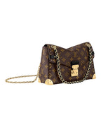 Louis Vuitton Trunkie monogram canvas shoulder bag angled view with gold chain strap and metallic hardware.