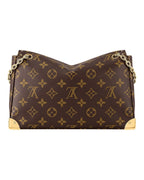 Louis Vuitton Trunkie monogram canvas shoulder bag close-up view with metallic corner accents and chain strap.