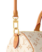 MOAH shoes Louis Vuitton Speedy Bandouliere handbag with monogram canvas, tan leather trim, and gold-tone hardware.
